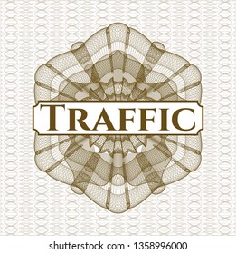 Brown money style rosette with text Traffic inside