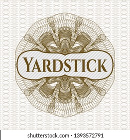 Brown money style rosette with text Yardstick inside