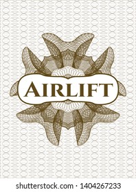 Brown money style rosette with text Airlift inside
