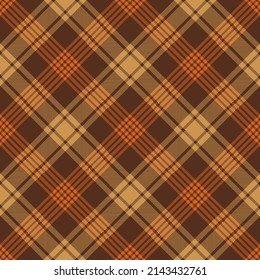 Brown and orange argyle tartan plaid. Scottish pattern fabric swatch close-up. 