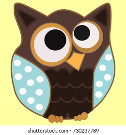 Brown owl with blue wings in speckles and centered eyes