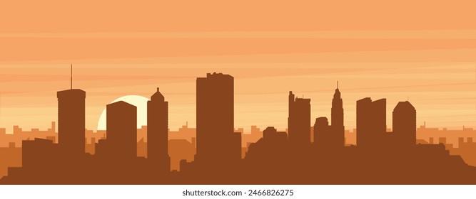 Brown panoramic poster of the city skyline with misty background buildings, sunrise, clouds and mountains of COLUMBUS, UNITED STATES