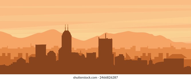 Brown panoramic poster of the city skyline with misty background buildings, sunrise, clouds and mountains of INDIANAPOLIS, UNITED STATES