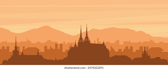 Brown panoramic poster of the city skyline with misty background buildings, sunrise, clouds and mountains of BRNO, CZECH REPUBLIC