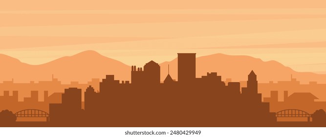 Brown panoramic poster of the city skyline with misty background buildings, sunrise, clouds and mountains of PITTSBURGH, UNITED STATES