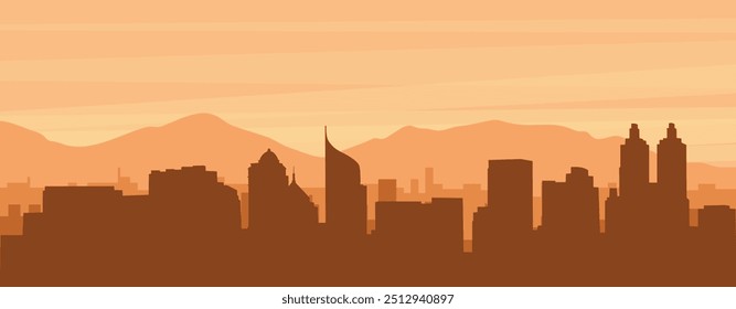 Brown panoramic poster of the city skyline with misty background buildings, sunrise, clouds and mountains of JAKARTA, INDONESIA