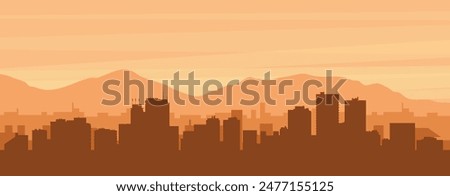 Brown panoramic poster of the city skyline with misty background buildings, sunrise, clouds and mountains of ANCHORAGE, UNITED STATES