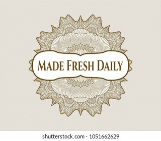 Brown passport rossete with text Made Fresh Daily inside