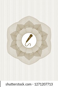 Brown passport style rosette with microphone icon inside