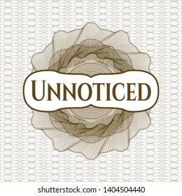 Brown passport style rosette with text Unnoticed inside