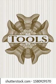 Brown passport style rosette with text Tools inside