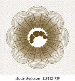 Brown passport style rossete with croissant icon inside