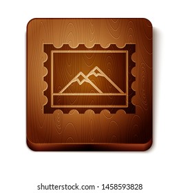 Brown Postal stamp and Mountains icon isolated on white background. Wooden square button. Vector Illustration