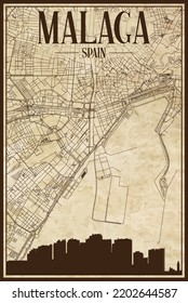 Brown printout streets network map with city skyline of the downtown MALAGA, SPAIN on a vintage paper framed background