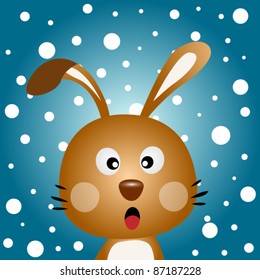 Brown rabbit with snowy background