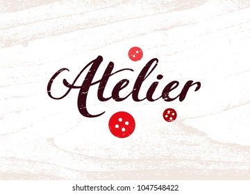 Brown Retro Calligraphy Logo Of Atelier With Bright Red Buttons On White Wooden Background. Template Of Banner For Seamstress. Hand Drawn Lettering Word 