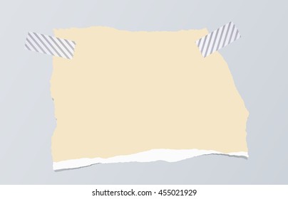 Brown ripped blank note paper are stuck with sticky tape on gray background