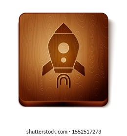 Brown Rocket ship with fire icon isolated on white background. Space travel. Wooden square button. Vector Illustration