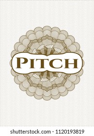 Brown rosette or money style emblem with text Pitch inside