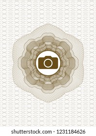Brown rosette or money style emblem with photo camera icon inside