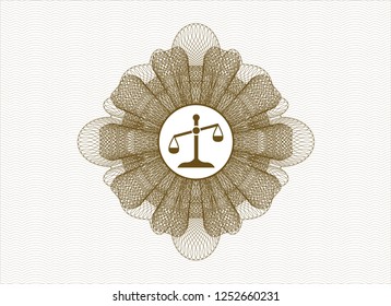 Brown rosette or money style emblem with scale icon inside
