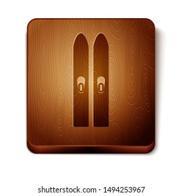 Brown Ski and sticks icon isolated on white background. Extreme sport. Skiing equipment. Winter sports icon. Wooden square button. Vector Illustration