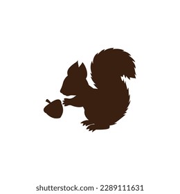 Brown squirrel with acorn silhouette vector on a white background