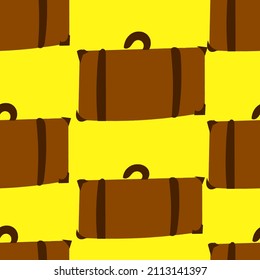 brown suitcase on yellow background