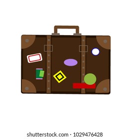 Brown suitcase with stickers