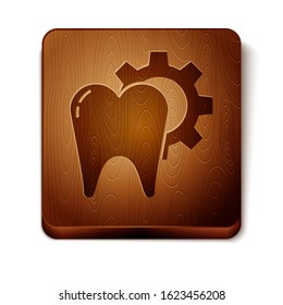 Brown Tooth treatment procedure icon isolated on white background. Tooth repair with gear. Wooden square button. Vector Illustration