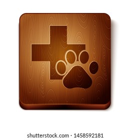 Brown Veterinary clinic symbol icon isolated on white background. Cross hospital sign. A stylized paw print dog or cat. Pet First Aid sign. Wooden square button. Vector Illustration