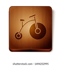 Brown Vintage bicycle with one big wheel and one small icon isolated on white background. Bike public transportation sign. Wooden square button. Vector Illustration