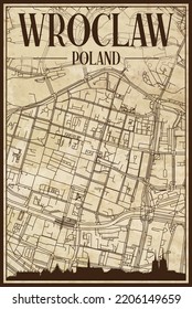 Brown vintage hand-drawn printout streets network map of the downtown WROCLAW, POLAND with brown city skyline and lettering