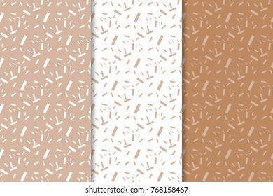 Brown and white geometric set of seamless patterns for web, textile and wallpapers