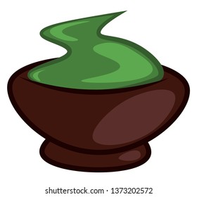 A brown-colored clay bowl filled with wasabi a Japanese plant with a thick green root that tastes like strong horseradish and used in cooking either in powder or paste form as an accompaniment