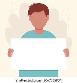 Brunette boy with a blank placard or signboard holding in hands. Call to action concept. Young man on a peace protest, manifestation, demonstration or picket, expressing a point of view.