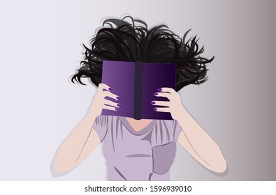 Brunette girl lying on the floor reading a book, top view
