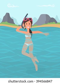 Brunette Girl swims in the sea in a mask for diving. She has been diving at a resort on the coast of the island.