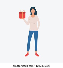Brunette holding red gift. Jeans, red socks, present. Can be used for topics like Saint Valentines Day, festival, celebration