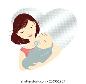 Brunette mother holding baby in front of a heart.