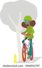 
Brunette woman riding a bicycle down the street on the bike path