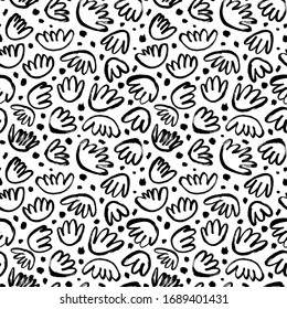 Brush black abstract flowers and dots vector seamless pattern. Hand drawn black paint ink illustration with abstract floral motif. Hand drawn painting for your fabric, wrapping paper, wallpaper design