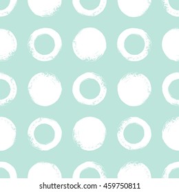 Brush or chalk drawn circles seamless vector pattern. Rough edges. Round shapes background. Mint green and white regular texture.
