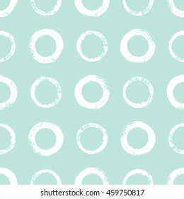 Brush or chalk drawn circles seamless vector pattern. Rough edges. Round shapes background. Mint green and white regular texture.