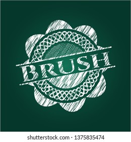 Brush chalkboard emblem written on a blackboard