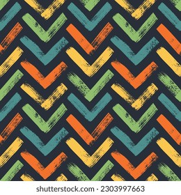 Brush drawn bold herrigbones colored seamless pattern. Vector zigzag motif. Colorful geometric chevron abstract background with rough bold stripes. Modern background in sketchy style. Grunge pattern.