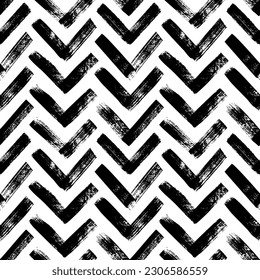 Brush drawn bold herrigbones seamless pattern. Vector zigzag motif. Geometric chevron abstract background with rough bold stripes. Modern geometric background in sketchy style. Grunge chevron pattern.