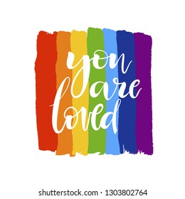 Brush drawn rough stripes on white background in rainbow colors and You are loved lettering. LGBT culture sign. Gay pride design element. 