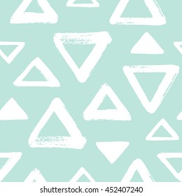Brush drawn triangles seamless vector pattern. Geometric doodle style background. Abstract hand drawn texture. Various triangle shapes or silhouettes with rough, uneven edges. Mint green and white.