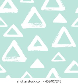 Brush drawn triangles seamless vector pattern. Geometric doodle style background. Abstract hand drawn texture. Various triangle shapes or silhouettes with rough, uneven edges. Mint green and white.